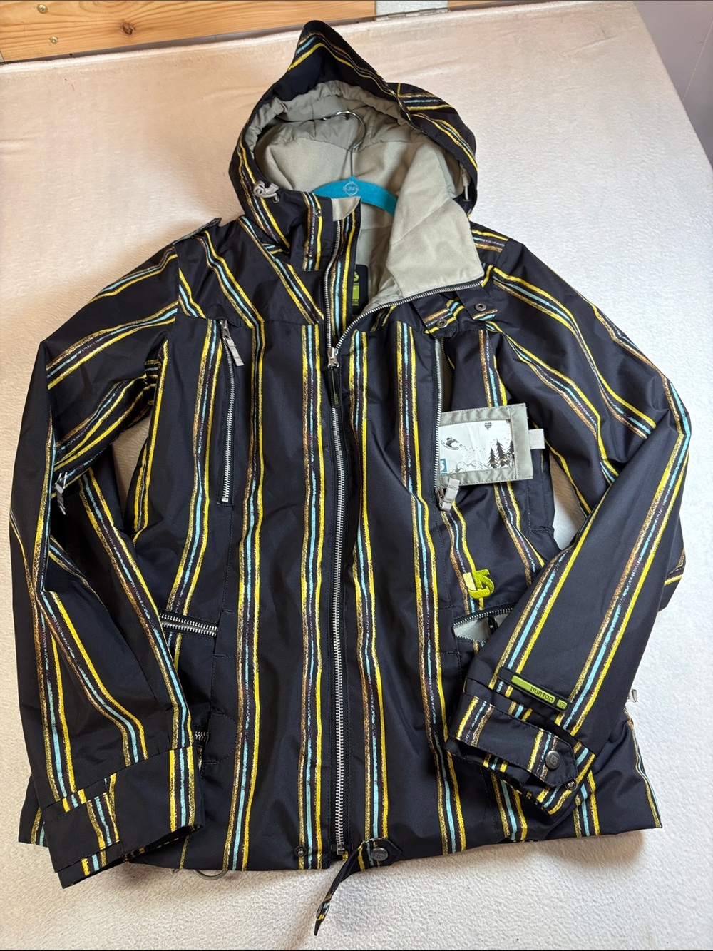Burton Black Ski Jacket with Yellow and Blue Stripes